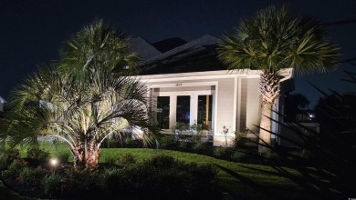 This beautifully landscaped property is situated directly on the on Wild Wing Plantation in South Carolina - for sale on GolfHomes.com, golf home, golf lot