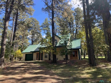 Discover this sweet mountain cabin perfectly situated along the on Pendaries Village Community Assoc. in New Mexico - for sale on GolfHomes.com, golf home, golf lot