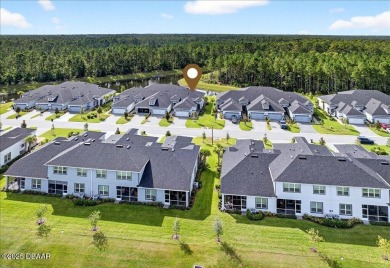 The Arbor II Townhome features a low-maintenance design with a on Plantation Bay Golf and Country Club in Florida - for sale on GolfHomes.com, golf home, golf lot