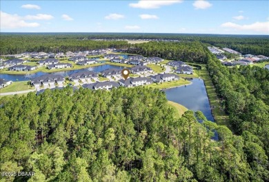 The Arbor II Townhome features a low-maintenance design with a on Plantation Bay Golf and Country Club in Florida - for sale on GolfHomes.com, golf home, golf lot