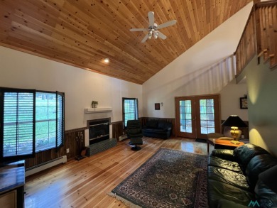 Discover this sweet mountain cabin perfectly situated along the on Pendaries Village Community Assoc. in New Mexico - for sale on GolfHomes.com, golf home, golf lot