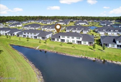 The Arbor II Townhome features a low-maintenance design with a on Plantation Bay Golf and Country Club in Florida - for sale on GolfHomes.com, golf home, golf lot