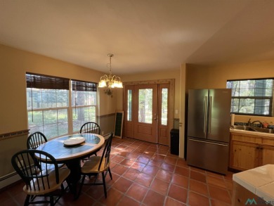 Discover this sweet mountain cabin perfectly situated along the on Pendaries Village Community Assoc. in New Mexico - for sale on GolfHomes.com, golf home, golf lot