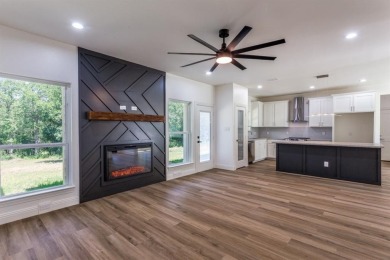 Discover modern comfort and style in this beautifully built new on The Club At Runaway Bay in Texas - for sale on GolfHomes.com, golf home, golf lot