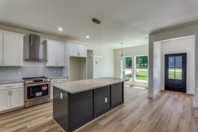 Discover modern comfort and style in this beautifully built new on The Club At Runaway Bay in Texas - for sale on GolfHomes.com, golf home, golf lot
