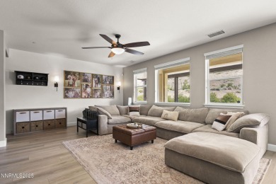 The spacious primary suite includes a private balcony where you on DAndrea Golf Club in Nevada - for sale on GolfHomes.com, golf home, golf lot