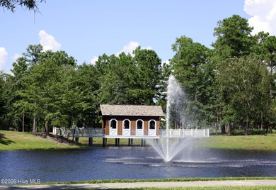 Enjoy building your custom home on a beautifully wooded golf on Rivers Edge Golf Club in North Carolina - for sale on GolfHomes.com, golf home, golf lot