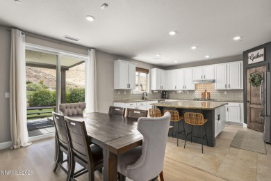 The spacious primary suite includes a private balcony where you on DAndrea Golf Club in Nevada - for sale on GolfHomes.com, golf home, golf lot