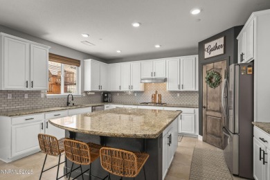 The spacious primary suite includes a private balcony where you on DAndrea Golf Club in Nevada - for sale on GolfHomes.com, golf home, golf lot