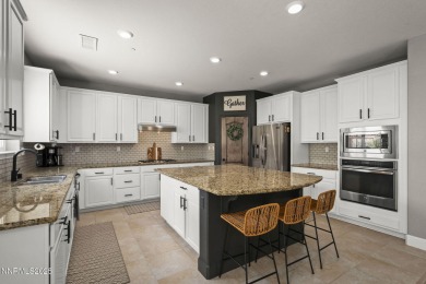 The spacious primary suite includes a private balcony where you on DAndrea Golf Club in Nevada - for sale on GolfHomes.com, golf home, golf lot