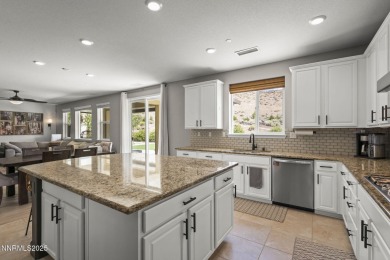 The spacious primary suite includes a private balcony where you on DAndrea Golf Club in Nevada - for sale on GolfHomes.com, golf home, golf lot