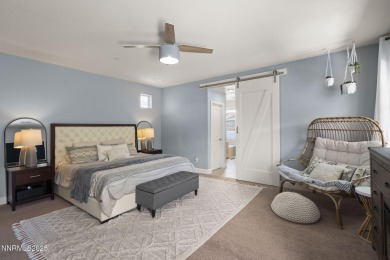 The spacious primary suite includes a private balcony where you on DAndrea Golf Club in Nevada - for sale on GolfHomes.com, golf home, golf lot