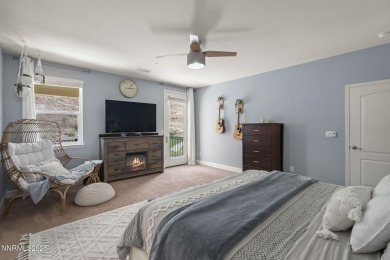 The spacious primary suite includes a private balcony where you on DAndrea Golf Club in Nevada - for sale on GolfHomes.com, golf home, golf lot