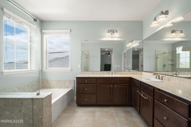 The spacious primary suite includes a private balcony where you on DAndrea Golf Club in Nevada - for sale on GolfHomes.com, golf home, golf lot