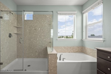The spacious primary suite includes a private balcony where you on DAndrea Golf Club in Nevada - for sale on GolfHomes.com, golf home, golf lot