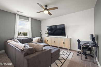 The spacious primary suite includes a private balcony where you on DAndrea Golf Club in Nevada - for sale on GolfHomes.com, golf home, golf lot