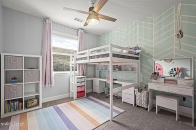 The spacious primary suite includes a private balcony where you on DAndrea Golf Club in Nevada - for sale on GolfHomes.com, golf home, golf lot