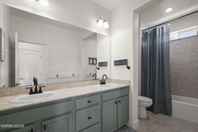 The spacious primary suite includes a private balcony where you on DAndrea Golf Club in Nevada - for sale on GolfHomes.com, golf home, golf lot