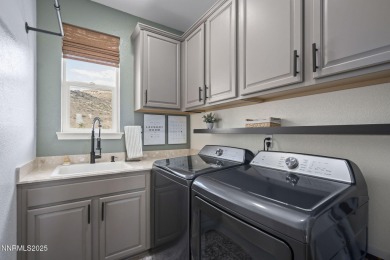 The spacious primary suite includes a private balcony where you on DAndrea Golf Club in Nevada - for sale on GolfHomes.com, golf home, golf lot