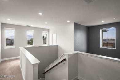 The spacious primary suite includes a private balcony where you on DAndrea Golf Club in Nevada - for sale on GolfHomes.com, golf home, golf lot