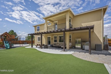 The spacious primary suite includes a private balcony where you on DAndrea Golf Club in Nevada - for sale on GolfHomes.com, golf home, golf lot