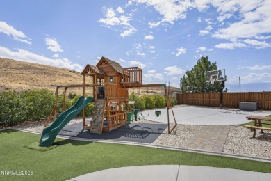 The spacious primary suite includes a private balcony where you on DAndrea Golf Club in Nevada - for sale on GolfHomes.com, golf home, golf lot