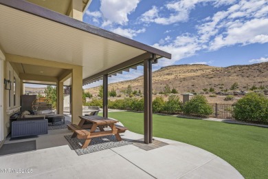 The spacious primary suite includes a private balcony where you on DAndrea Golf Club in Nevada - for sale on GolfHomes.com, golf home, golf lot