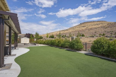 The spacious primary suite includes a private balcony where you on DAndrea Golf Club in Nevada - for sale on GolfHomes.com, golf home, golf lot