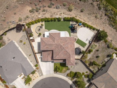 The spacious primary suite includes a private balcony where you on DAndrea Golf Club in Nevada - for sale on GolfHomes.com, golf home, golf lot