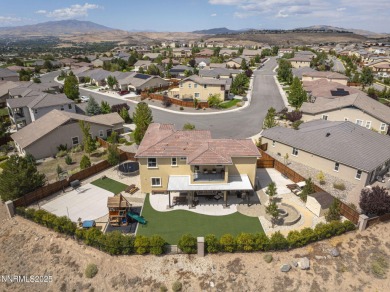 The spacious primary suite includes a private balcony where you on DAndrea Golf Club in Nevada - for sale on GolfHomes.com, golf home, golf lot