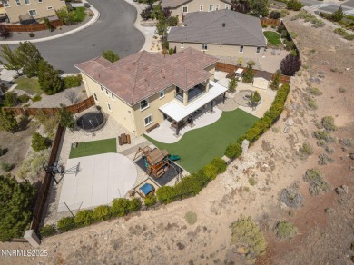 The spacious primary suite includes a private balcony where you on DAndrea Golf Club in Nevada - for sale on GolfHomes.com, golf home, golf lot
