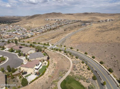 The spacious primary suite includes a private balcony where you on DAndrea Golf Club in Nevada - for sale on GolfHomes.com, golf home, golf lot