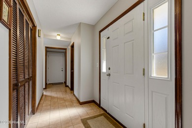 This home is situated on an expansive 3/4-acre homesite in one on Carolina Shores Golf Course in North Carolina - for sale on GolfHomes.com, golf home, golf lot