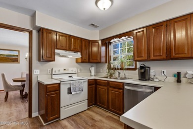 This home is situated on an expansive 3/4-acre homesite in one on Carolina Shores Golf Course in North Carolina - for sale on GolfHomes.com, golf home, golf lot