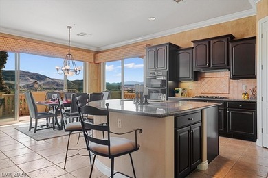 Enjoy sweeping mountain and golf course views that capture the on Reflection Bay Golf Club in Nevada - for sale on GolfHomes.com, golf home, golf lot