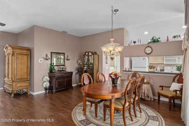 This end-unit Sea Breeze Villa nestled within Pine Meadow on Heritage Pines Country Club in Florida - for sale on GolfHomes.com, golf home, golf lot