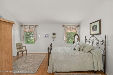 This end-unit Sea Breeze Villa nestled within Pine Meadow on Heritage Pines Country Club in Florida - for sale on GolfHomes.com, golf home, golf lot