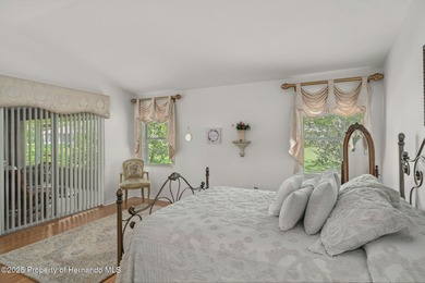 This end-unit Sea Breeze Villa nestled within Pine Meadow on Heritage Pines Country Club in Florida - for sale on GolfHomes.com, golf home, golf lot