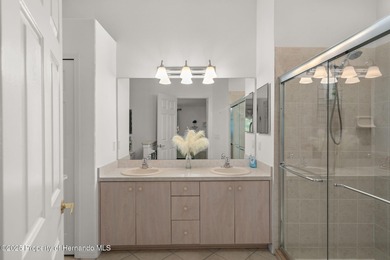 This end-unit Sea Breeze Villa nestled within Pine Meadow on Heritage Pines Country Club in Florida - for sale on GolfHomes.com, golf home, golf lot