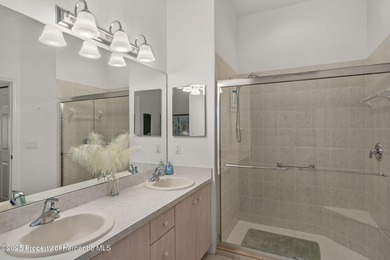 This end-unit Sea Breeze Villa nestled within Pine Meadow on Heritage Pines Country Club in Florida - for sale on GolfHomes.com, golf home, golf lot