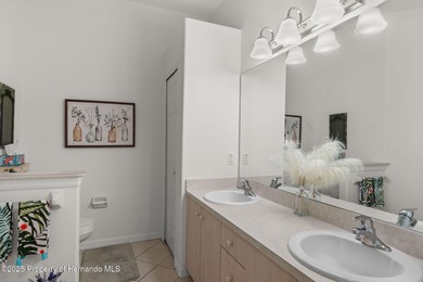 This end-unit Sea Breeze Villa nestled within Pine Meadow on Heritage Pines Country Club in Florida - for sale on GolfHomes.com, golf home, golf lot