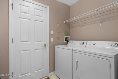 This end-unit Sea Breeze Villa nestled within Pine Meadow on Heritage Pines Country Club in Florida - for sale on GolfHomes.com, golf home, golf lot