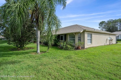 This end-unit Sea Breeze Villa nestled within Pine Meadow on Heritage Pines Country Club in Florida - for sale on GolfHomes.com, golf home, golf lot