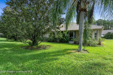 This end-unit Sea Breeze Villa nestled within Pine Meadow on Heritage Pines Country Club in Florida - for sale on GolfHomes.com, golf home, golf lot