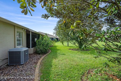 This end-unit Sea Breeze Villa nestled within Pine Meadow on Heritage Pines Country Club in Florida - for sale on GolfHomes.com, golf home, golf lot