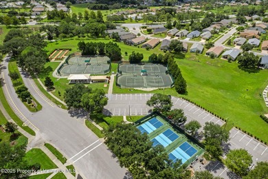 This end-unit Sea Breeze Villa nestled within Pine Meadow on Heritage Pines Country Club in Florida - for sale on GolfHomes.com, golf home, golf lot