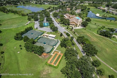 This end-unit Sea Breeze Villa nestled within Pine Meadow on Heritage Pines Country Club in Florida - for sale on GolfHomes.com, golf home, golf lot