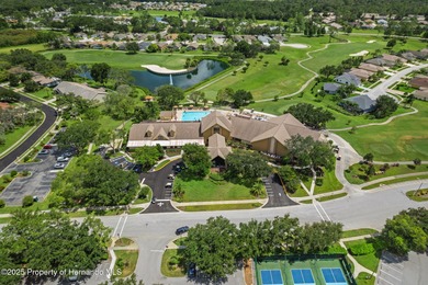 This end-unit Sea Breeze Villa nestled within Pine Meadow on Heritage Pines Country Club in Florida - for sale on GolfHomes.com, golf home, golf lot