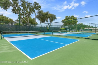 This end-unit Sea Breeze Villa nestled within Pine Meadow on Heritage Pines Country Club in Florida - for sale on GolfHomes.com, golf home, golf lot