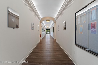 This end-unit Sea Breeze Villa nestled within Pine Meadow on Heritage Pines Country Club in Florida - for sale on GolfHomes.com, golf home, golf lot